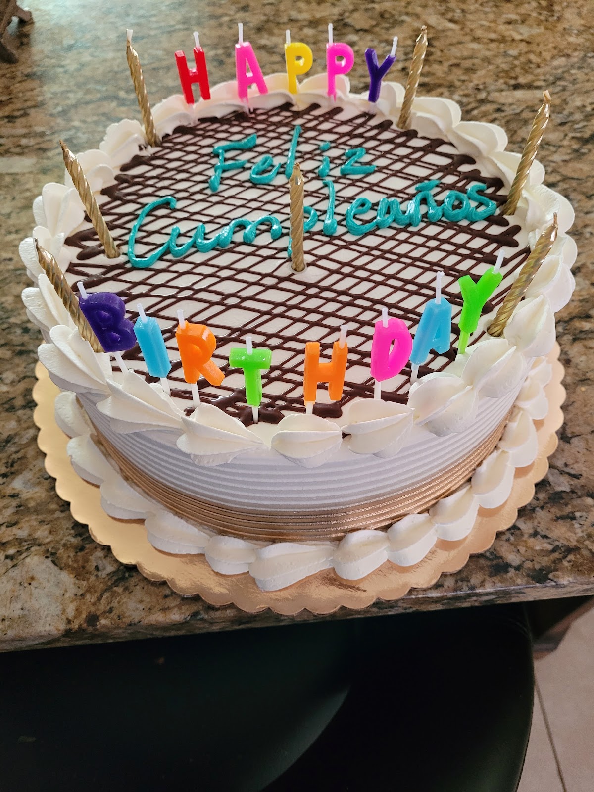 A custom birthday cake with chocolate drizzle and whipped cream from Aliona's Euro Bake